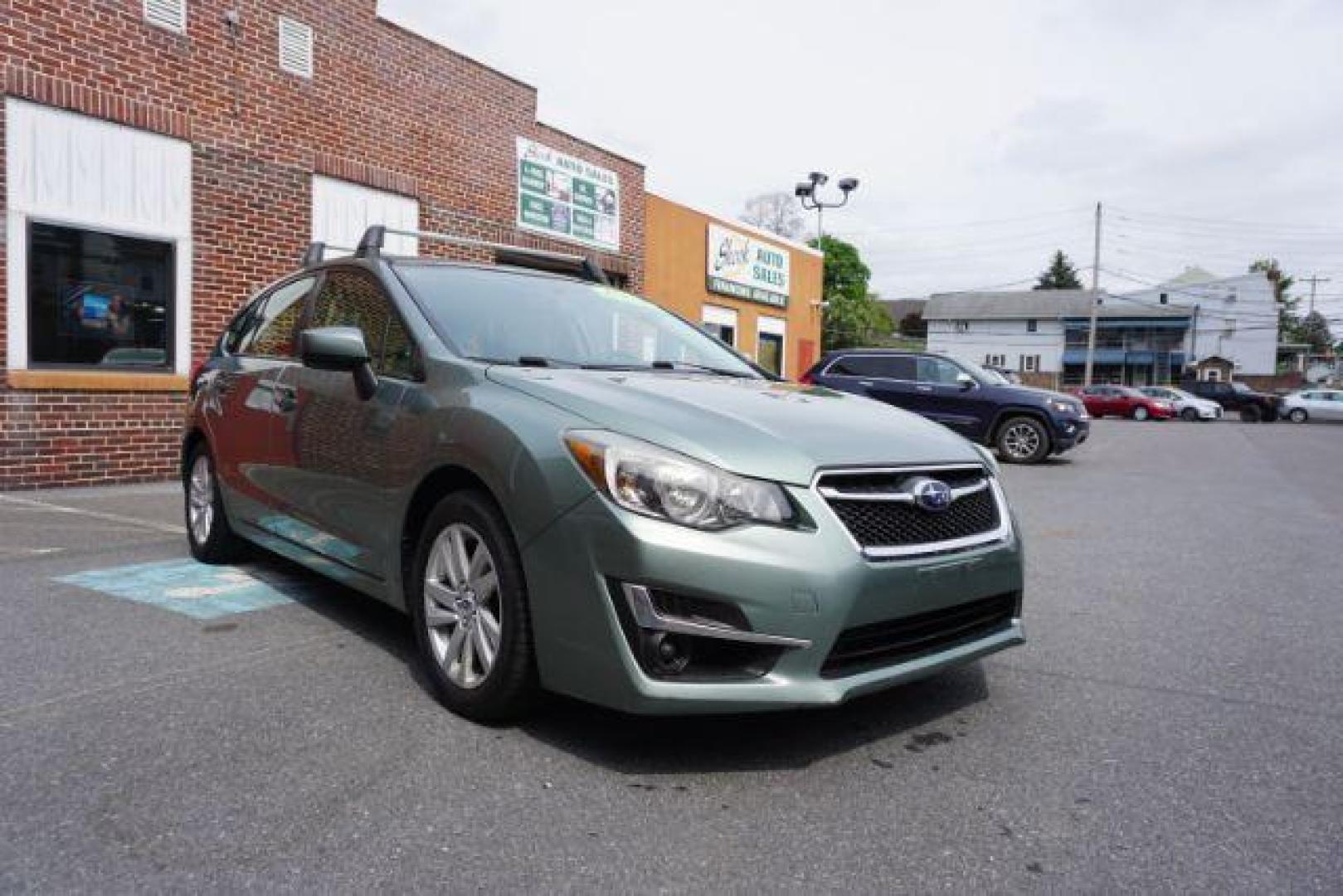 2015 Jasmine Green Metallic /Ivory, cloth Subaru Impreza 2.0i Premium PZEV 5-Door (JF1GPAC63FH) with an 2.0L H4 DOHC 16V engine, Continuously Variable Transmission transmission, located at 312 Centre Ave, Schuylkill Haven, PA, 17972, (570) 593-5278, 40.638130, -76.177383 - Photo#6