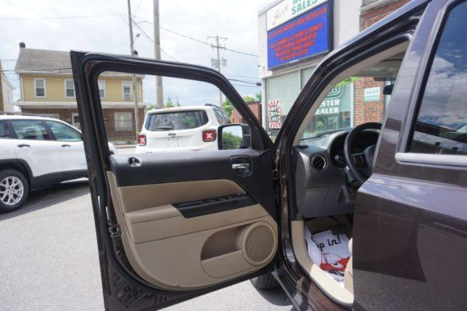 2014 Rugged Brown Pearlcoat /Light Pebble Beige/Dk Slate Jeep Patriot Latitude 4WD (1C4NJRFB3ED) with an 2.4L L4 DOHC 16V engine, Continuously Variable Transmission transmission, located at 312 Centre Ave, Schuylkill Haven, PA, 17972, (570) 593-5278, 40.638130, -76.177383 - Boston Accoustics stereo, locking/limited slip differential, power sunroof - Photo#16
