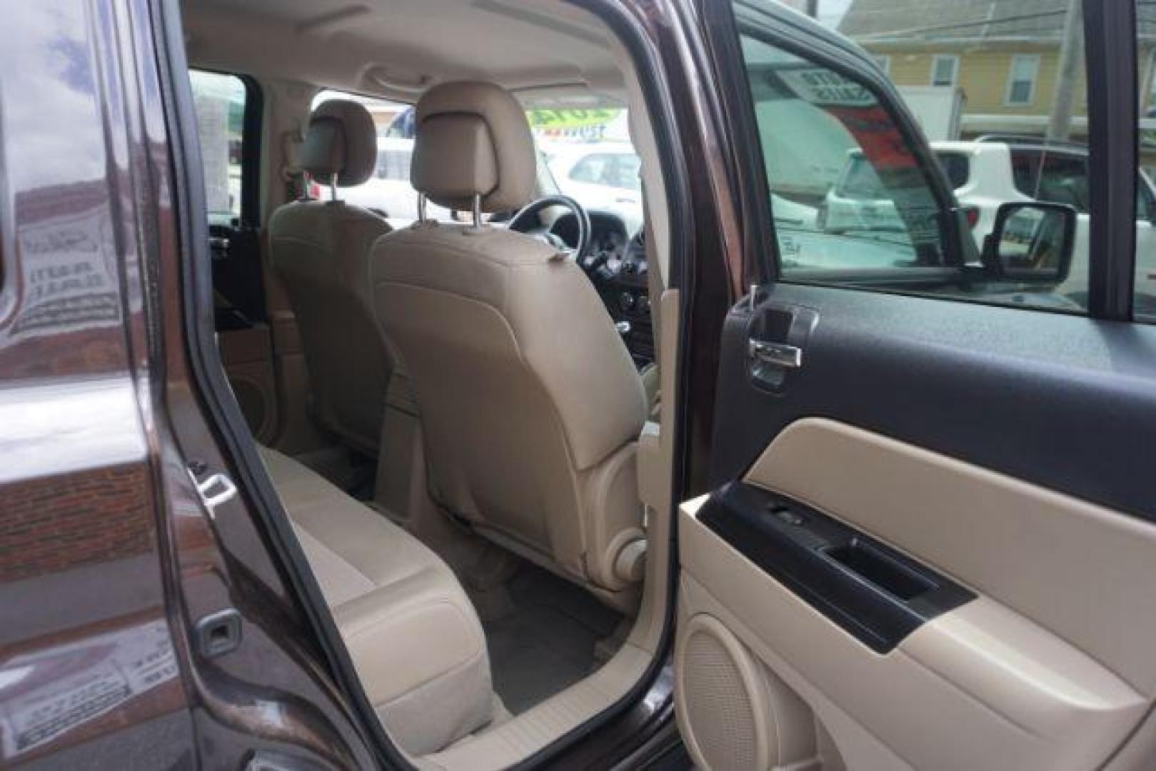 2014 Rugged Brown Pearlcoat /Light Pebble Beige/Dk Slate Jeep Patriot Latitude 4WD (1C4NJRFB3ED) with an 2.4L L4 DOHC 16V engine, Continuously Variable Transmission transmission, located at 312 Centre Ave, Schuylkill Haven, PA, 17972, (570) 593-5278, 40.638130, -76.177383 - Boston Accoustics stereo, locking/limited slip differential, power sunroof - Photo#40