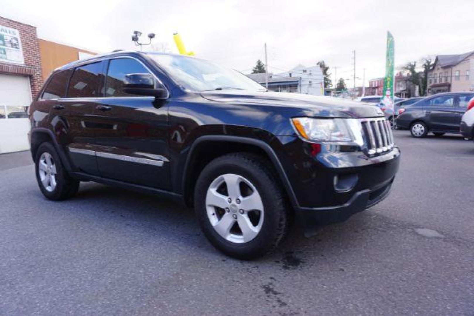 2012 Brilliant Black Crystal Pearl /Black Leather Interior Jeep Grand Cherokee Laredo 4WD (1C4RJFAGXCC) with an 3.6L V6 DOHC 24V engine, 5-Speed Automatic transmission, located at 312 Centre Ave, Schuylkill Haven, PA, 17972, (570) 593-5278, 40.638130, -76.177383 - automatic climate control, back up camera, heated front seats, leather seats, navigation, power liftgate, power sunroof, rear parking sensors - Photo#7