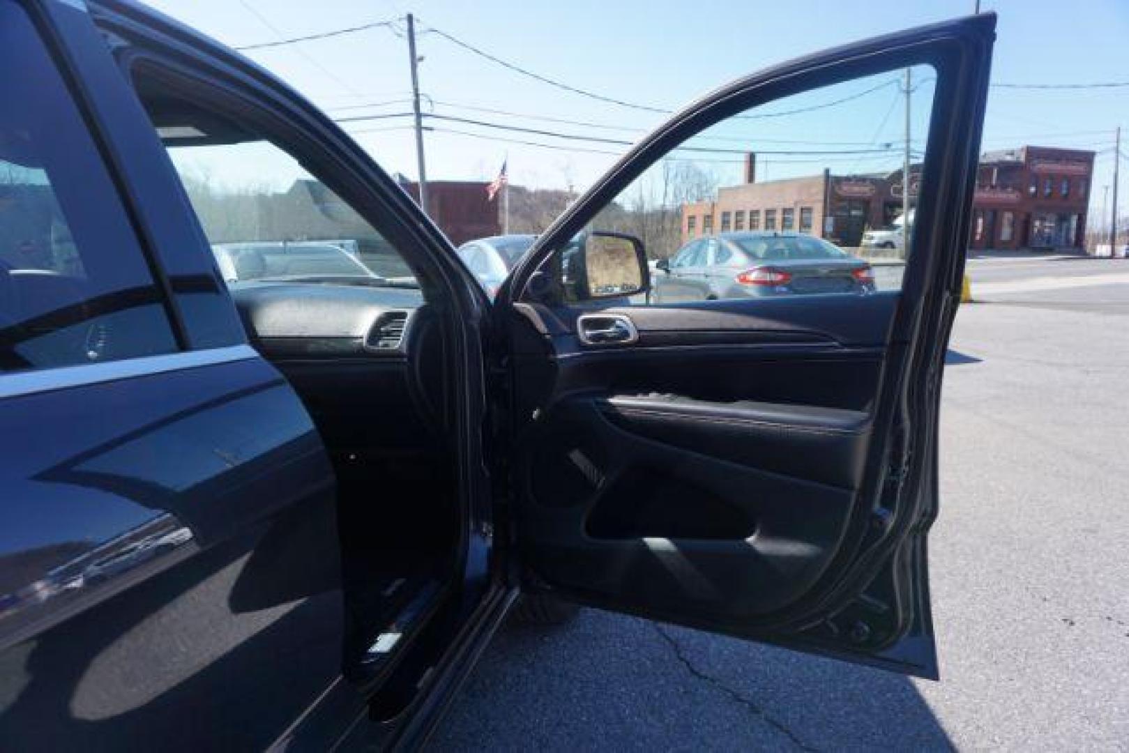2014 Granite Crystal Metallic Clearcoat /Black Jeep Grand Cherokee Limited (1C4RJFBG9EC) with an 3.6L V-6 DOHC engine, located at 312 Centre Ave, Schuylkill Haven, PA, 17972, (570) 593-5278, 40.638130, -76.177383 - collision avoidance, HID headlamps, navigation, power liftgate, power sunroof, universal garage door opener - Photo#46