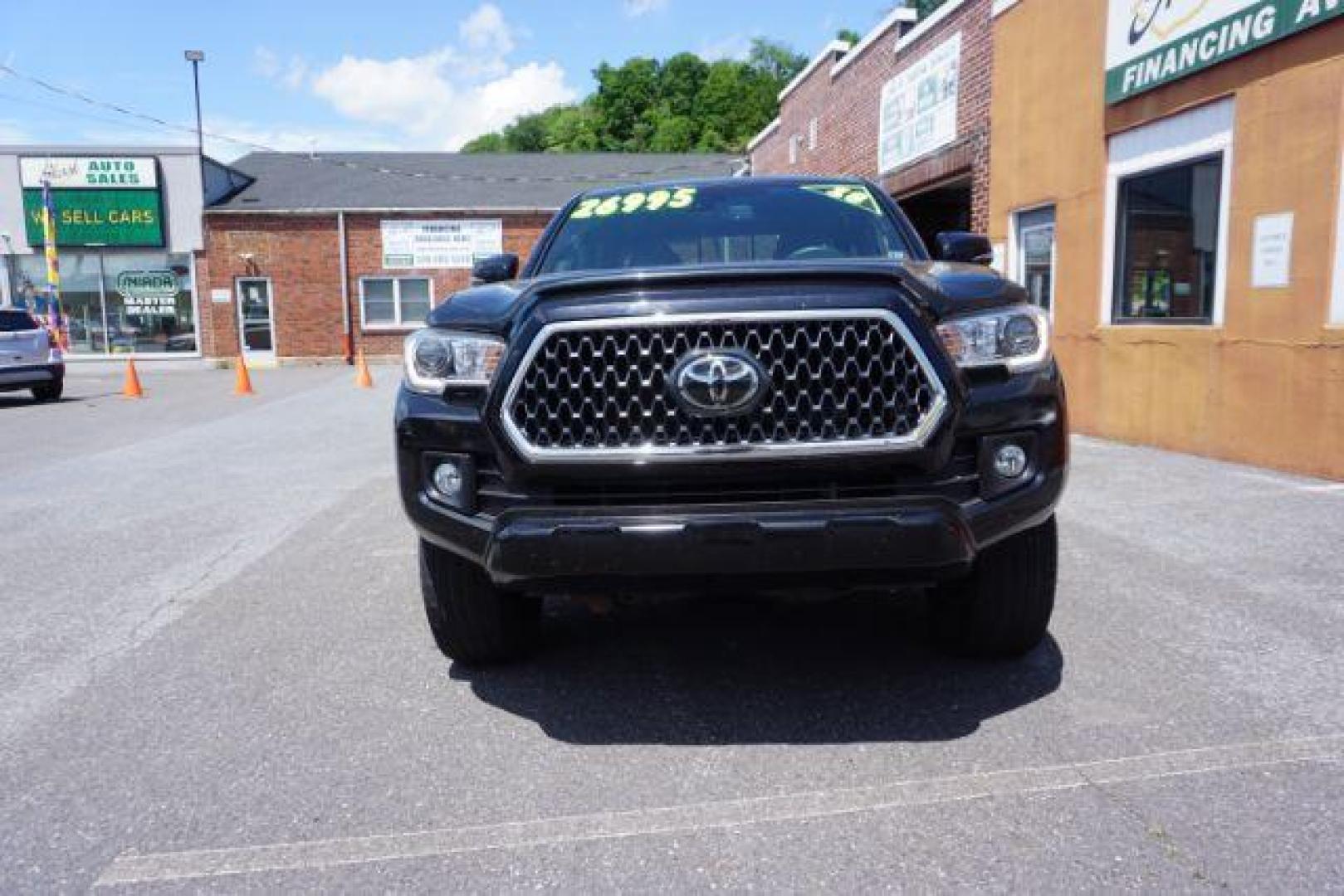 2018 Midnight Black Metallic Toyota Tacoma SR V6 | SR5 V6 | TRD Sport | TRD Off Road | TRD Pro | Limited (5TFCZ5AN4JX) with an 3.5L V-6 port/direct injection engine, located at 312 Centre Ave, Schuylkill Haven, PA, 17972, (570) 593-5278, 40.638130, -76.177383 - Aluminum/alloy wheels, Navigation system, rear parking sensor, hard bed cover, towing pkg - Photo#1