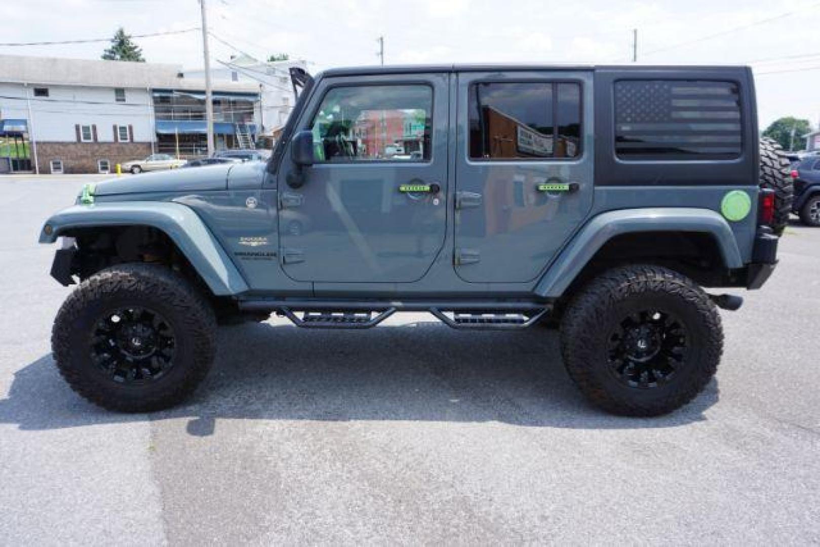 2015 Billet Silver Metallic Clearcoat /Black Jeep Wrangler Unlimited Sahara (1C4HJWEG5FL) with an 3.6L V-6 DOHC engine, located at 312 Centre Ave, Schuylkill Haven, PA, 17972, (570) 593-5278, 40.638130, -76.177383 - Photo#1