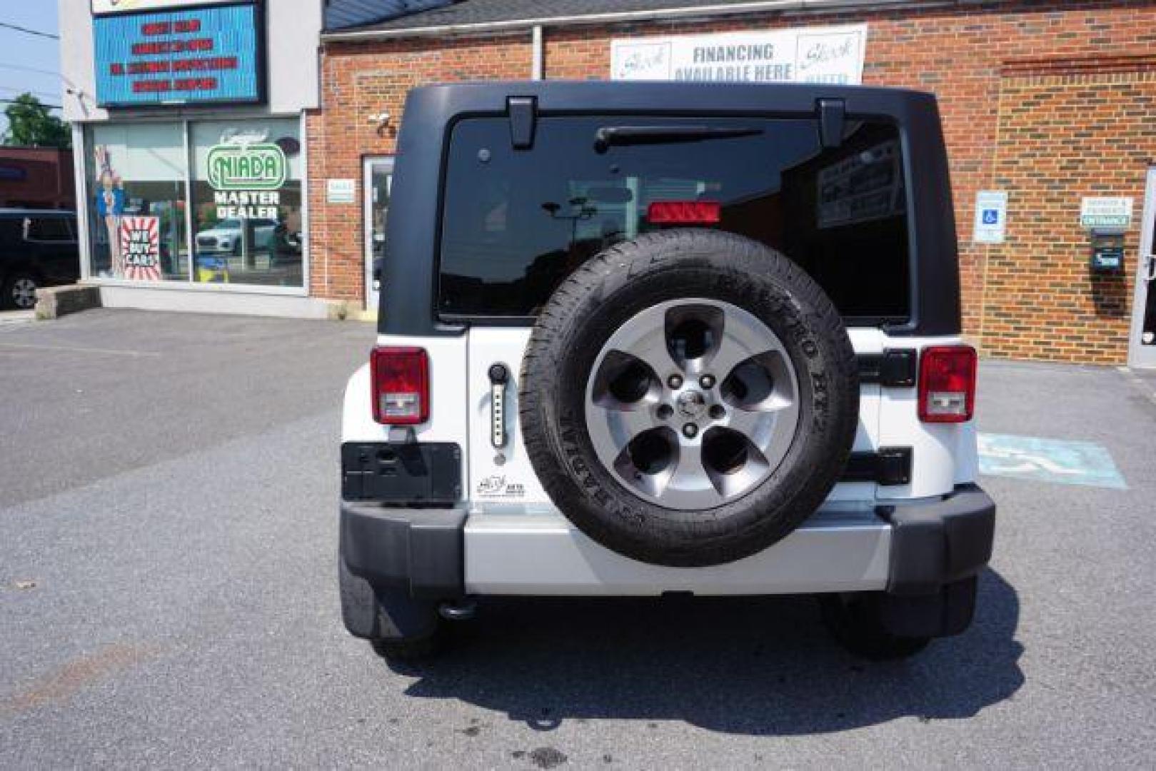 2018 Bright White Clearcoat /Black Jeep Wrangler JK Unlimited Sahara 4x4 (1C4BJWEG0JL) with an Pentastar 3.6L V-6 DOHC engine, located at 312 Centre Ave, Schuylkill Haven, PA, 17972, (570) 593-5278, 40.638130, -76.177383 - Photo#4