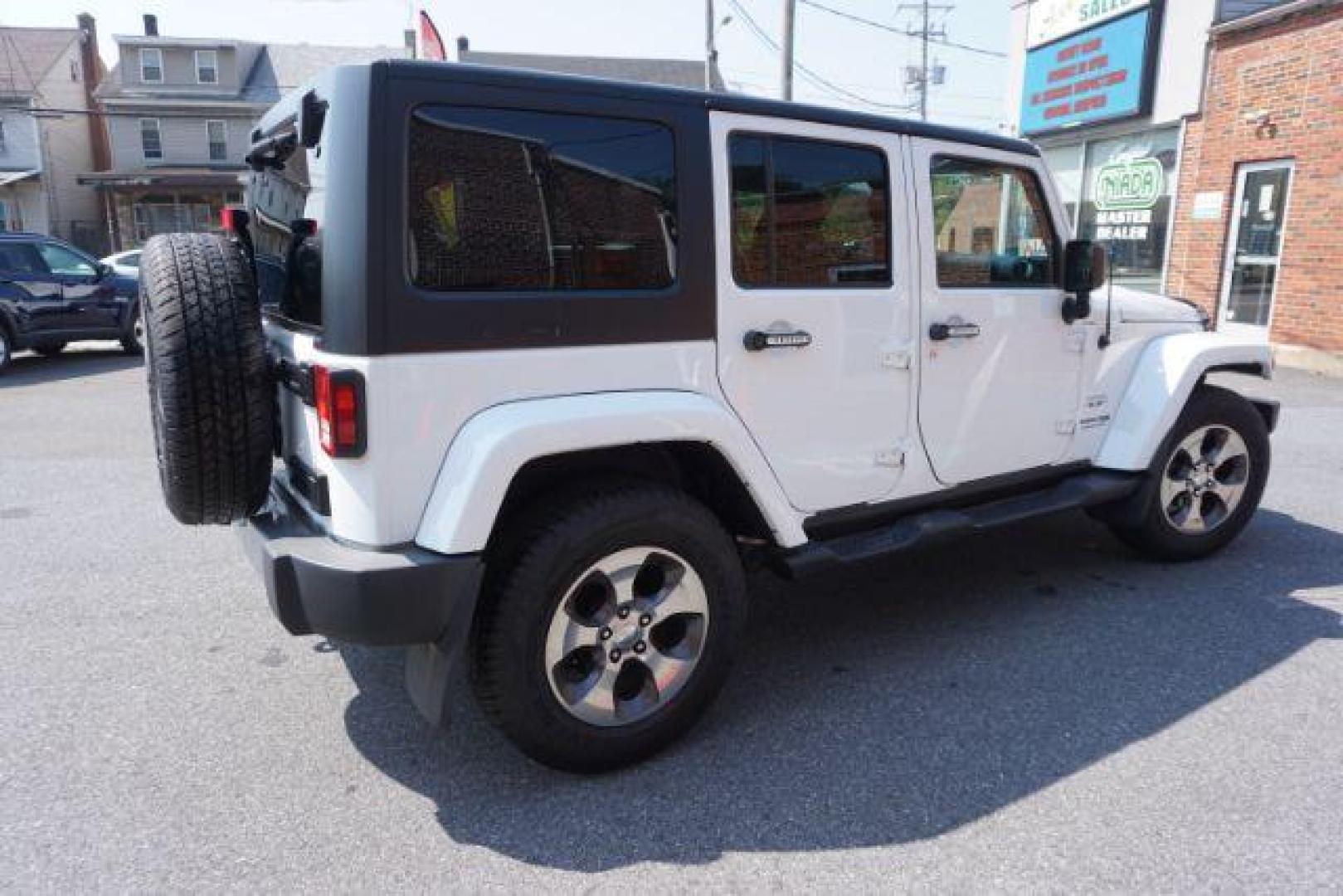 2018 Bright White Clearcoat /Black Jeep Wrangler JK Unlimited Sahara 4x4 (1C4BJWEG0JL) with an Pentastar 3.6L V-6 DOHC engine, located at 312 Centre Ave, Schuylkill Haven, PA, 17972, (570) 593-5278, 40.638130, -76.177383 - Photo#7