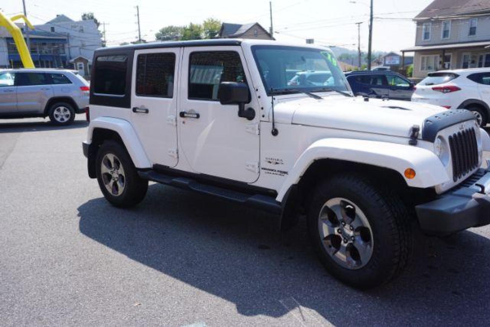 2018 Bright White Clearcoat /Black Jeep Wrangler JK Unlimited Sahara 4x4 (1C4BJWEG0JL) with an Pentastar 3.6L V-6 DOHC engine, located at 312 Centre Ave, Schuylkill Haven, PA, 17972, (570) 593-5278, 40.638130, -76.177383 - Photo#11