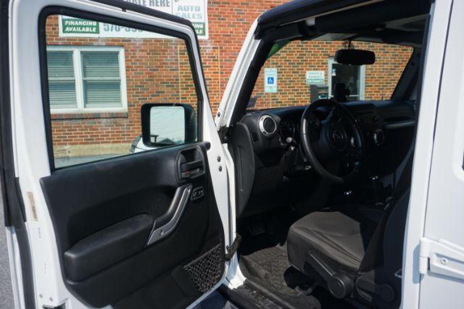 2018 Bright White Clearcoat /Black Jeep Wrangler JK Unlimited Sahara 4x4 (1C4BJWEG0JL) with an Pentastar 3.6L V-6 DOHC engine, located at 312 Centre Ave, Schuylkill Haven, PA, 17972, (570) 593-5278, 40.638130, -76.177383 - Photo#14