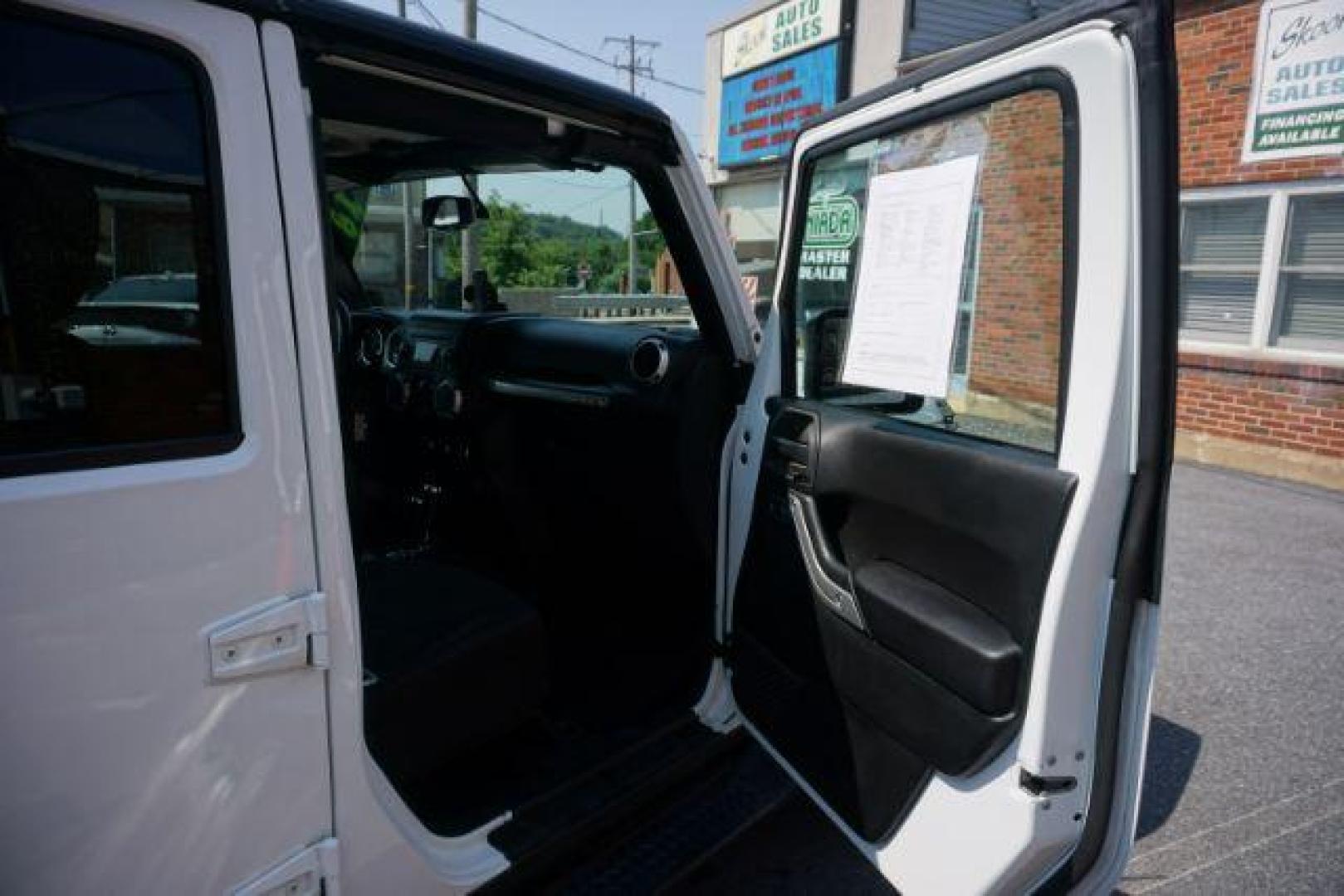 2018 Bright White Clearcoat /Black Jeep Wrangler JK Unlimited Sahara 4x4 (1C4BJWEG0JL) with an Pentastar 3.6L V-6 DOHC engine, located at 312 Centre Ave, Schuylkill Haven, PA, 17972, (570) 593-5278, 40.638130, -76.177383 - Photo#21
