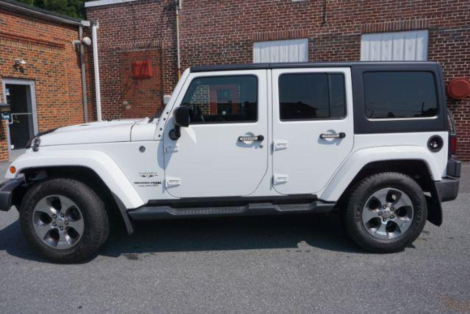 2018 Bright White Clearcoat /Black Jeep Wrangler JK Unlimited Sahara 4x4 (1C4BJWEG0JL) with an Pentastar 3.6L V-6 DOHC engine, located at 312 Centre Ave, Schuylkill Haven, PA, 17972, (570) 593-5278, 40.638130, -76.177383 - Photo#1