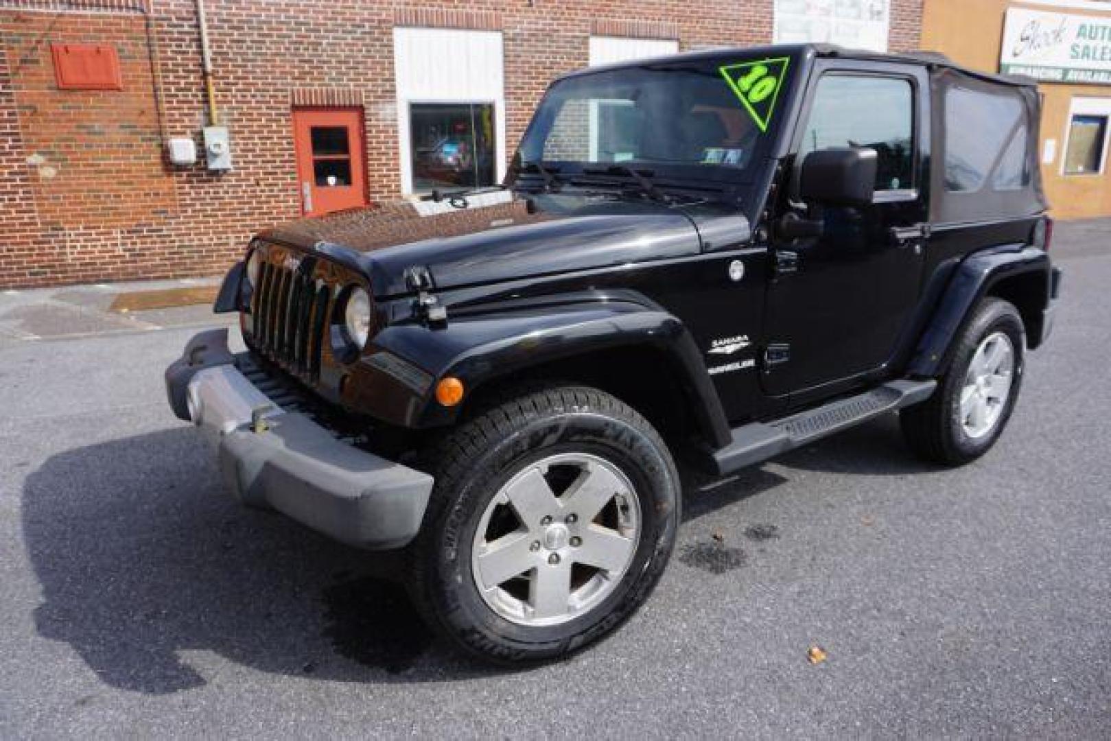 2010 Black Clearcoat/Black Soft Top /Dark Khaki/Medium Khaki Jeep Wrangler Sahara (1J4GA5D10AL) with an 3.8L V-6 regular unleaded engine, located at 312 Centre Ave, Schuylkill Haven, PA, 17972, (570) 593-5278, 40.638130, -76.177383 - Photo#2