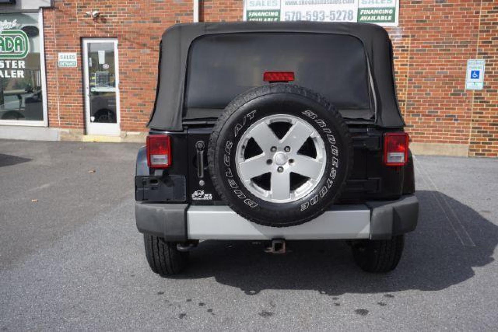 2010 Black Clearcoat/Black Soft Top /Dark Khaki/Medium Khaki Jeep Wrangler Sahara (1J4GA5D10AL) with an 3.8L V-6 regular unleaded engine, located at 312 Centre Ave, Schuylkill Haven, PA, 17972, (570) 593-5278, 40.638130, -76.177383 - Photo#8