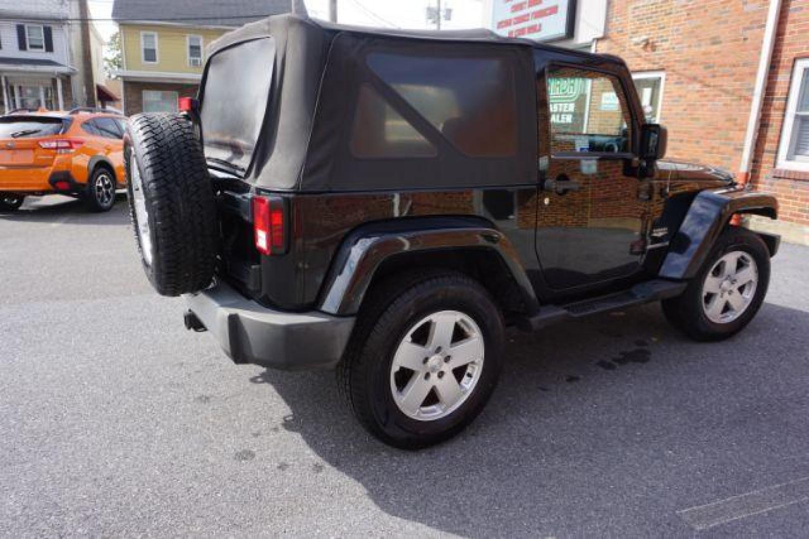 2010 Black Clearcoat/Black Soft Top /Dark Khaki/Medium Khaki Jeep Wrangler Sahara (1J4GA5D10AL) with an 3.8L V-6 regular unleaded engine, located at 312 Centre Ave, Schuylkill Haven, PA, 17972, (570) 593-5278, 40.638130, -76.177383 - Photo#9