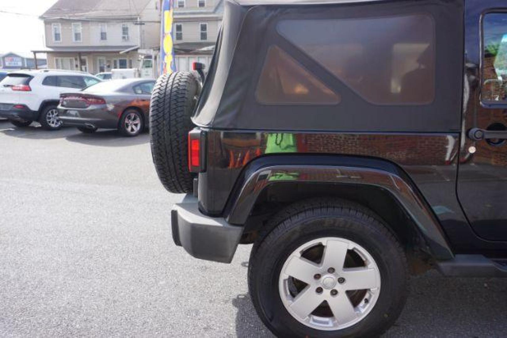 2010 Black Clearcoat/Black Soft Top /Dark Khaki/Medium Khaki Jeep Wrangler Sahara (1J4GA5D10AL) with an 3.8L V-6 regular unleaded engine, located at 312 Centre Ave, Schuylkill Haven, PA, 17972, (570) 593-5278, 40.638130, -76.177383 - Photo#11