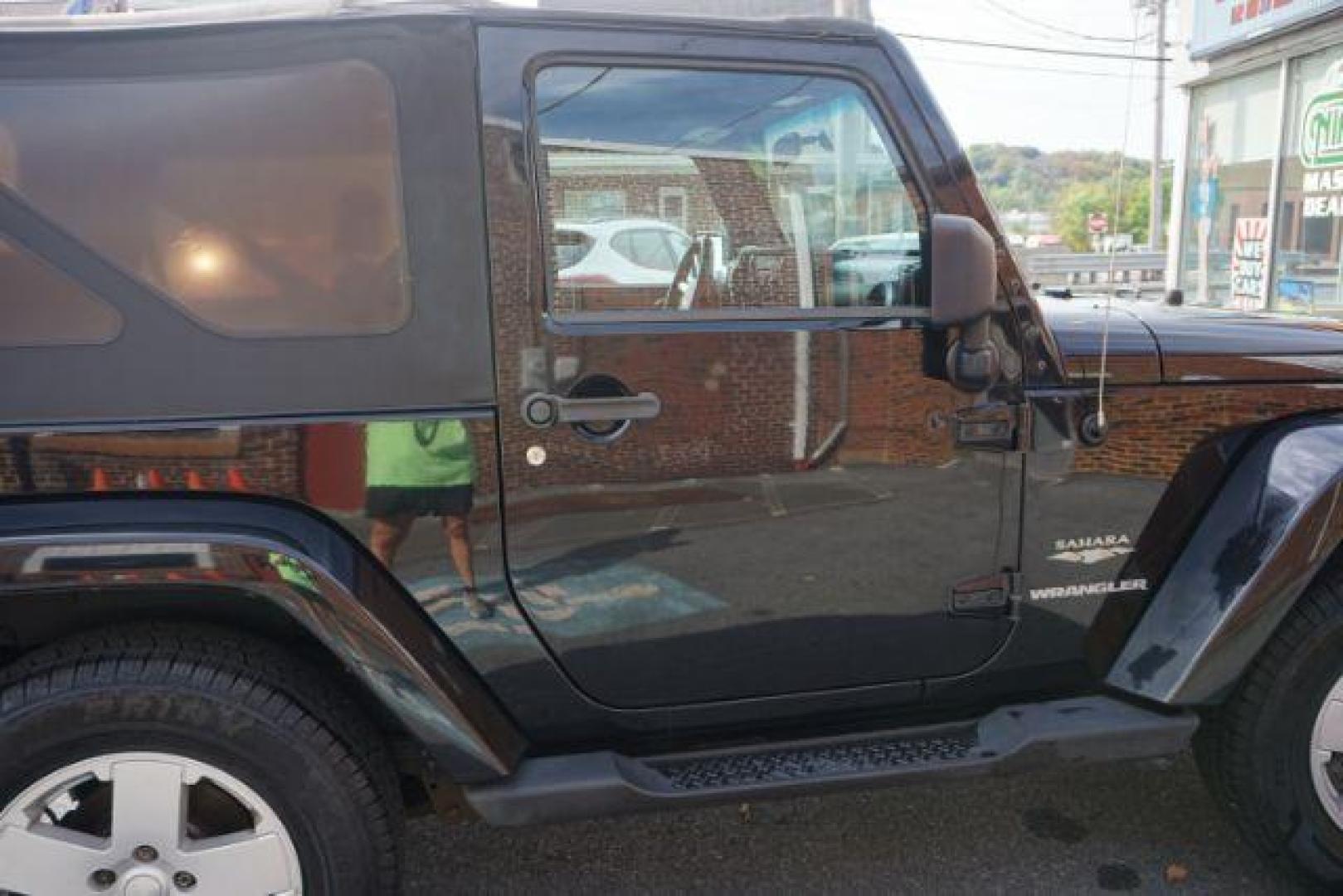 2010 Black Clearcoat/Black Soft Top /Dark Khaki/Medium Khaki Jeep Wrangler Sahara (1J4GA5D10AL) with an 3.8L V-6 regular unleaded engine, located at 312 Centre Ave, Schuylkill Haven, PA, 17972, (570) 593-5278, 40.638130, -76.177383 - Photo#13