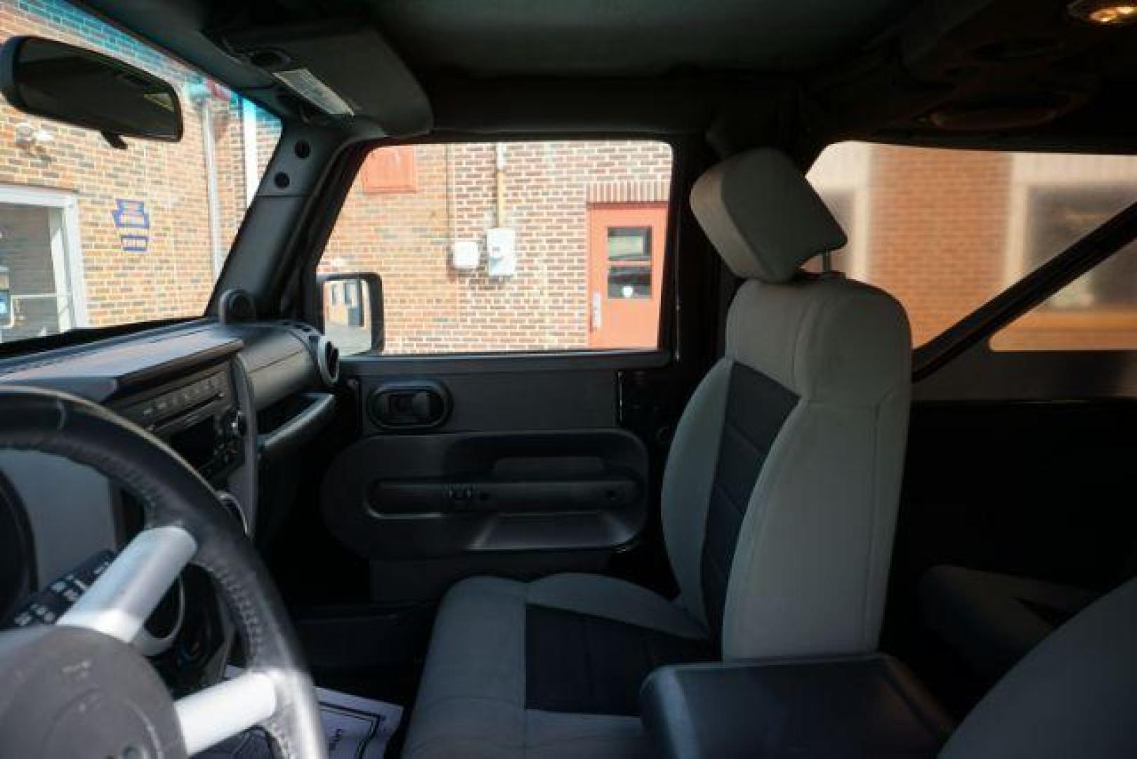 2010 Black Clearcoat/Black Soft Top /Dark Khaki/Medium Khaki Jeep Wrangler Sahara (1J4GA5D10AL) with an 3.8L V-6 regular unleaded engine, located at 312 Centre Ave, Schuylkill Haven, PA, 17972, (570) 593-5278, 40.638130, -76.177383 - Photo#18
