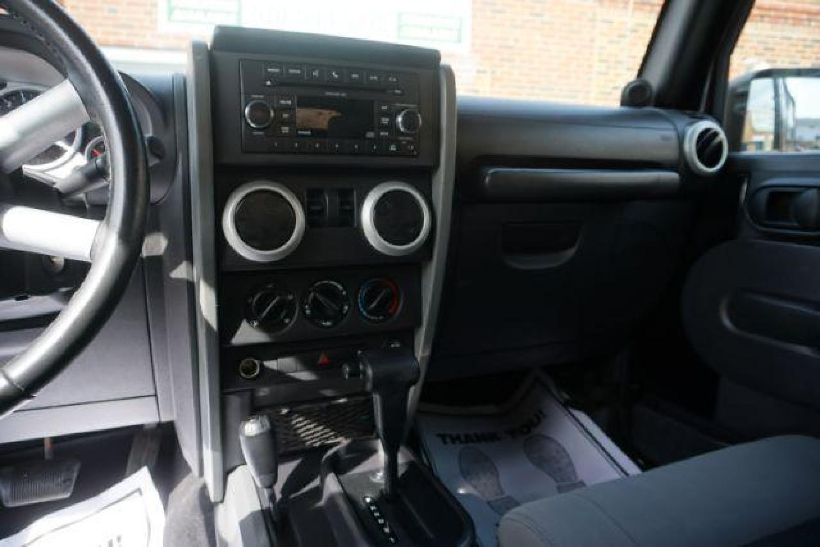 2010 Black Clearcoat/Black Soft Top /Dark Khaki/Medium Khaki Jeep Wrangler Sahara (1J4GA5D10AL) with an 3.8L V-6 regular unleaded engine, located at 312 Centre Ave, Schuylkill Haven, PA, 17972, (570) 593-5278, 40.638130, -76.177383 - Photo#19
