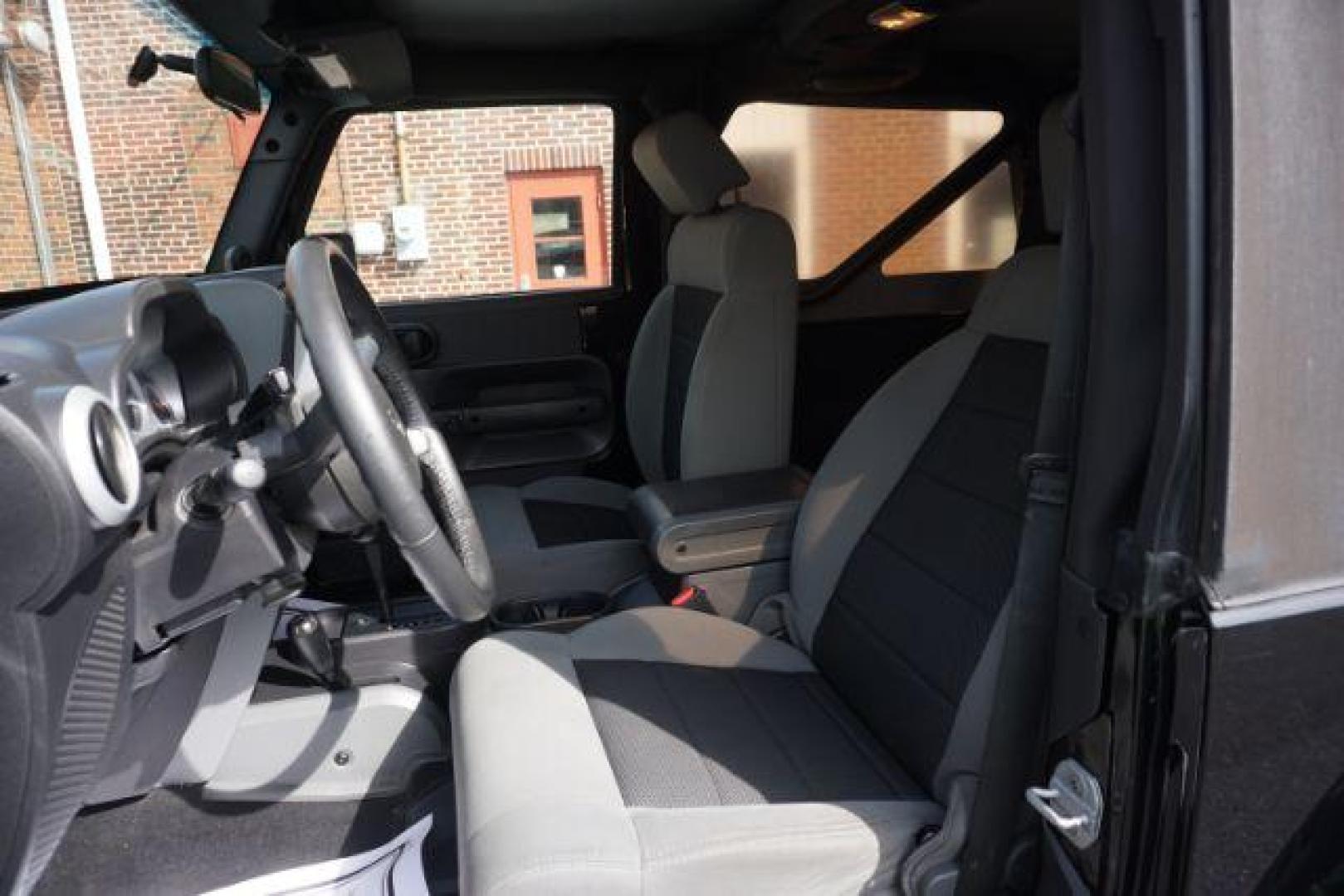 2010 Black Clearcoat/Black Soft Top /Dark Khaki/Medium Khaki Jeep Wrangler Sahara (1J4GA5D10AL) with an 3.8L V-6 regular unleaded engine, located at 312 Centre Ave, Schuylkill Haven, PA, 17972, (570) 593-5278, 40.638130, -76.177383 - Photo#20