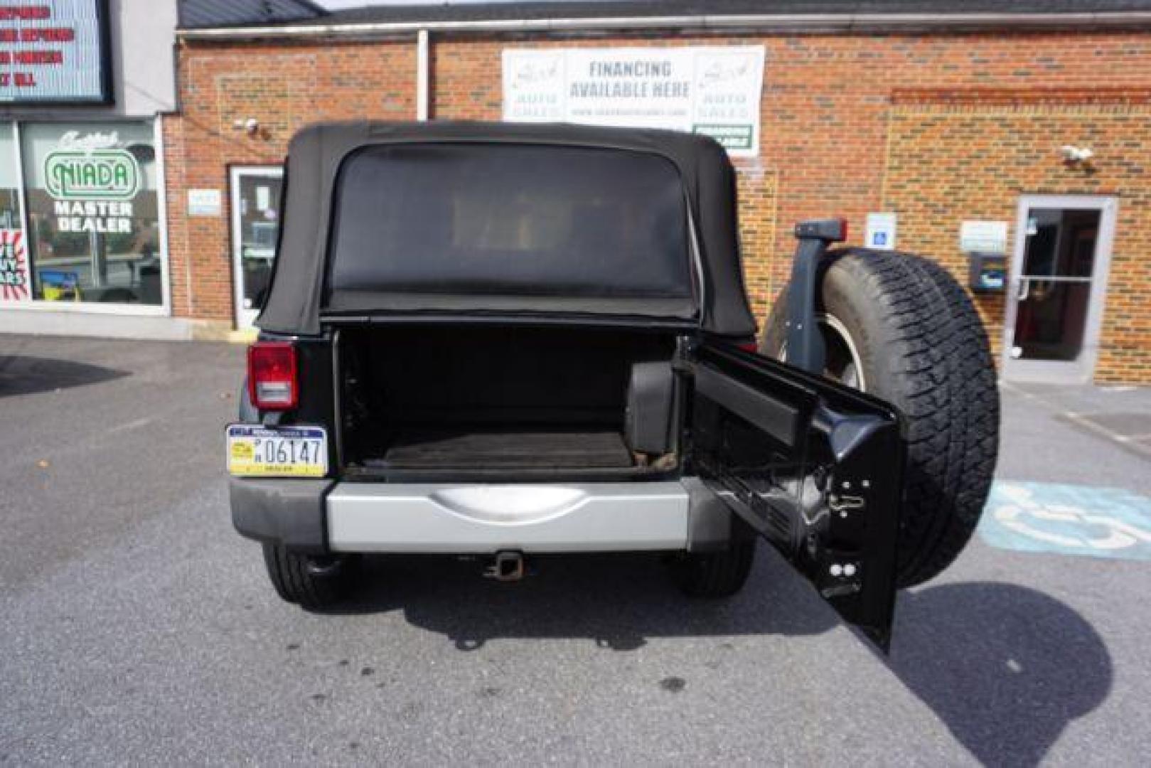2010 Black Clearcoat/Black Soft Top /Dark Khaki/Medium Khaki Jeep Wrangler Sahara (1J4GA5D10AL) with an 3.8L V-6 regular unleaded engine, located at 312 Centre Ave, Schuylkill Haven, PA, 17972, (570) 593-5278, 40.638130, -76.177383 - Photo#24