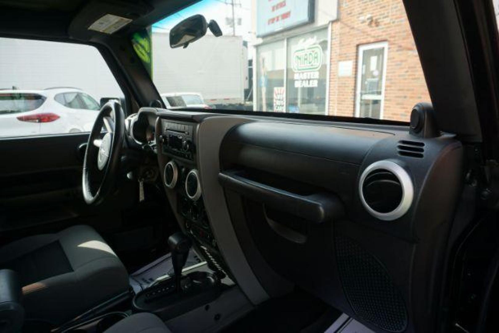 2010 Black Clearcoat/Black Soft Top /Dark Khaki/Medium Khaki Jeep Wrangler Sahara (1J4GA5D10AL) with an 3.8L V-6 regular unleaded engine, located at 312 Centre Ave, Schuylkill Haven, PA, 17972, (570) 593-5278, 40.638130, -76.177383 - Photo#26