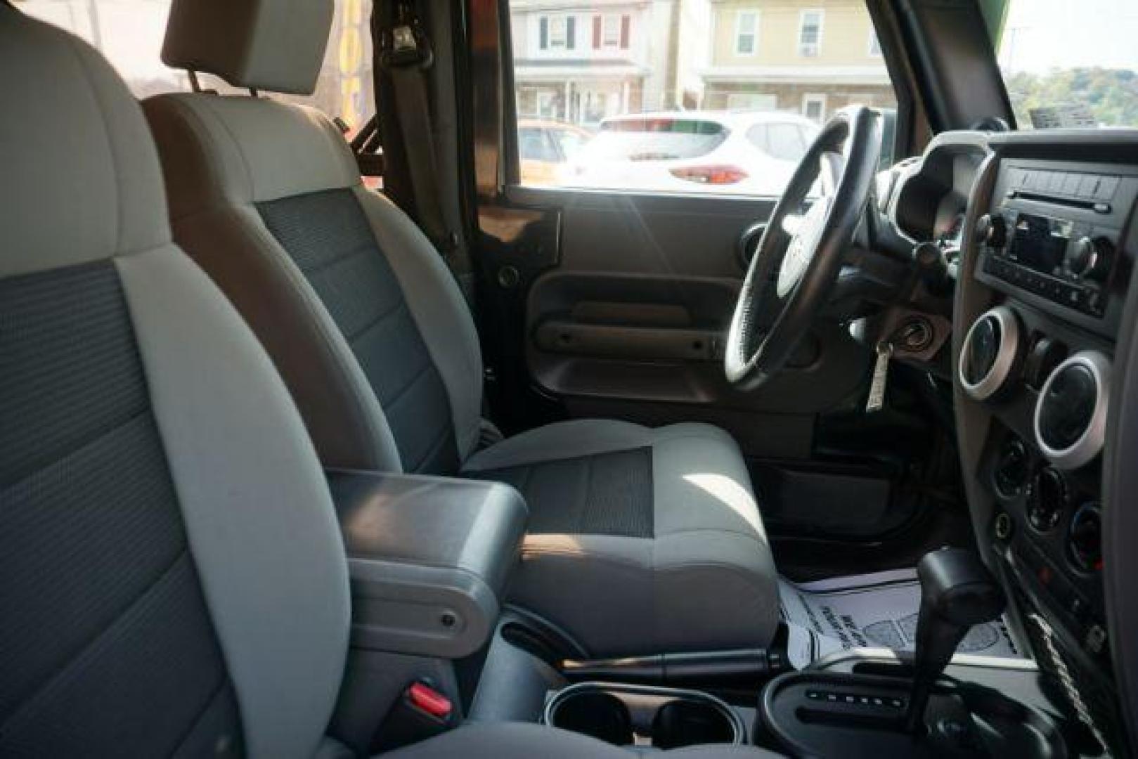2010 Black Clearcoat/Black Soft Top /Dark Khaki/Medium Khaki Jeep Wrangler Sahara (1J4GA5D10AL) with an 3.8L V-6 regular unleaded engine, located at 312 Centre Ave, Schuylkill Haven, PA, 17972, (570) 593-5278, 40.638130, -76.177383 - Photo#27
