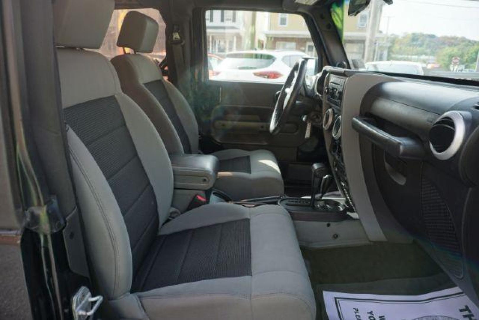 2010 Black Clearcoat/Black Soft Top /Dark Khaki/Medium Khaki Jeep Wrangler Sahara (1J4GA5D10AL) with an 3.8L V-6 regular unleaded engine, located at 312 Centre Ave, Schuylkill Haven, PA, 17972, (570) 593-5278, 40.638130, -76.177383 - Photo#28