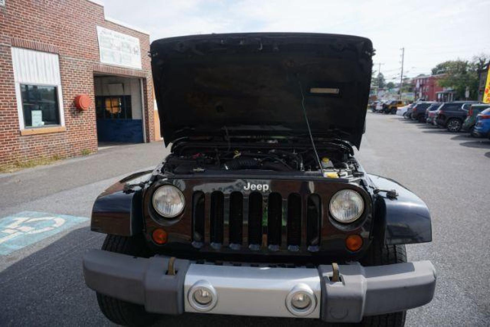 2010 Black Clearcoat/Black Soft Top /Dark Khaki/Medium Khaki Jeep Wrangler Sahara (1J4GA5D10AL) with an 3.8L V-6 regular unleaded engine, located at 312 Centre Ave, Schuylkill Haven, PA, 17972, (570) 593-5278, 40.638130, -76.177383 - Photo#32