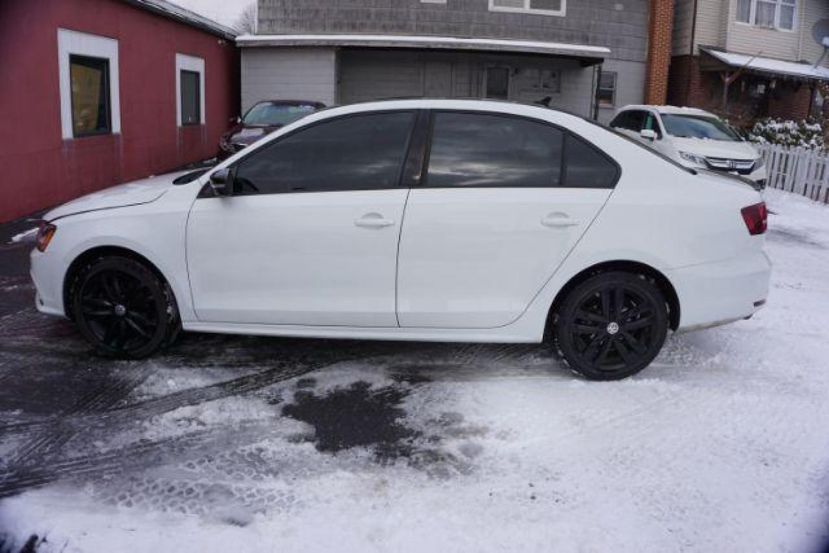 2018 Pure White w/Black Roof /Titan Black w/Black Headliner Volkswagen Jetta 1.8T SE Sport (3VWD17AJ9JM) with an 1.8L I-4 gasoline direct injection engine, located at 312 Centre Ave, Schuylkill Haven, PA, 17972, (570) 593-5278, 40.638130, -76.177383 - Photo#0