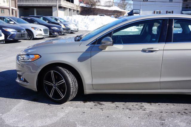 2015 Bronze Fire Metallic Tinted Clearcoat /Ebony Ford Fusion SE (3FA6P0T95FR) with an EcoBoost 2L I-4 gasoline direct injection engine, located at 312 Centre Ave, Schuylkill Haven, PA, 17972, (570) 593-5278, 40.638130, -76.177383 - Photo#1