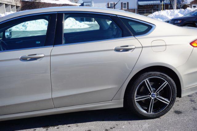 2015 Bronze Fire Metallic Tinted Clearcoat /Ebony Ford Fusion SE (3FA6P0T95FR) with an EcoBoost 2L I-4 gasoline direct injection engine, located at 312 Centre Ave, Schuylkill Haven, PA, 17972, (570) 593-5278, 40.638130, -76.177383 - Photo#6