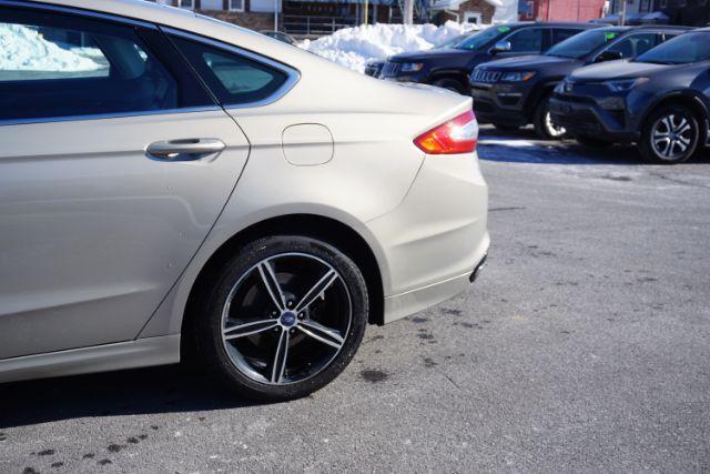 2015 Bronze Fire Metallic Tinted Clearcoat /Ebony Ford Fusion SE (3FA6P0T95FR) with an EcoBoost 2L I-4 gasoline direct injection engine, located at 312 Centre Ave, Schuylkill Haven, PA, 17972, (570) 593-5278, 40.638130, -76.177383 - Photo#7