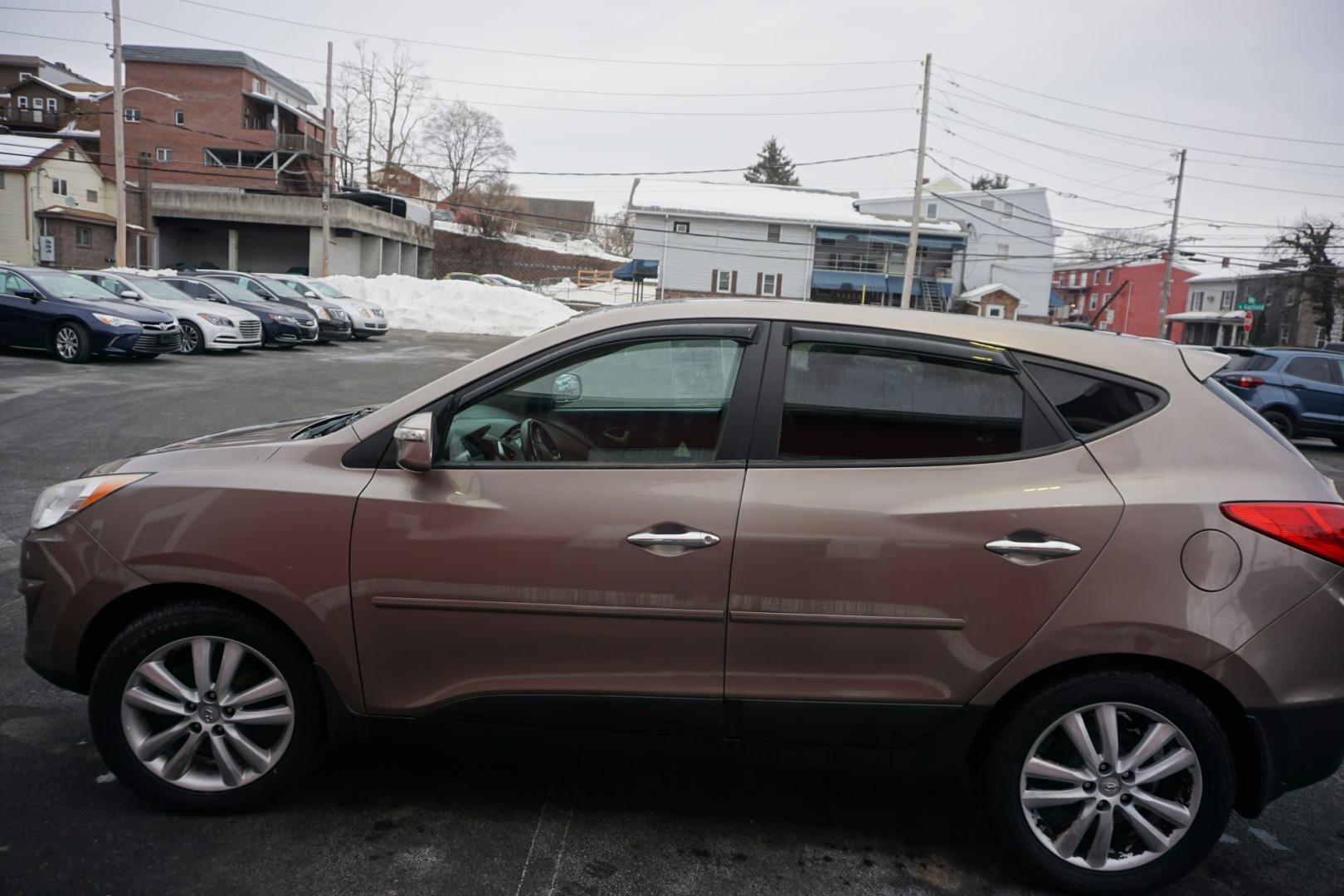 2010 Chai Bronze Metallic HYUNDAI TUCSON LIMITED (KM8JUCAC1AU) with an 2.4L L4 DOHC 16V engine, 6-Speed Automatic transmission, located at 312 Centre Ave, Schuylkill Haven, PA, 17972, (570) 593-5278, 40.638130, -76.177383 - Photo#0