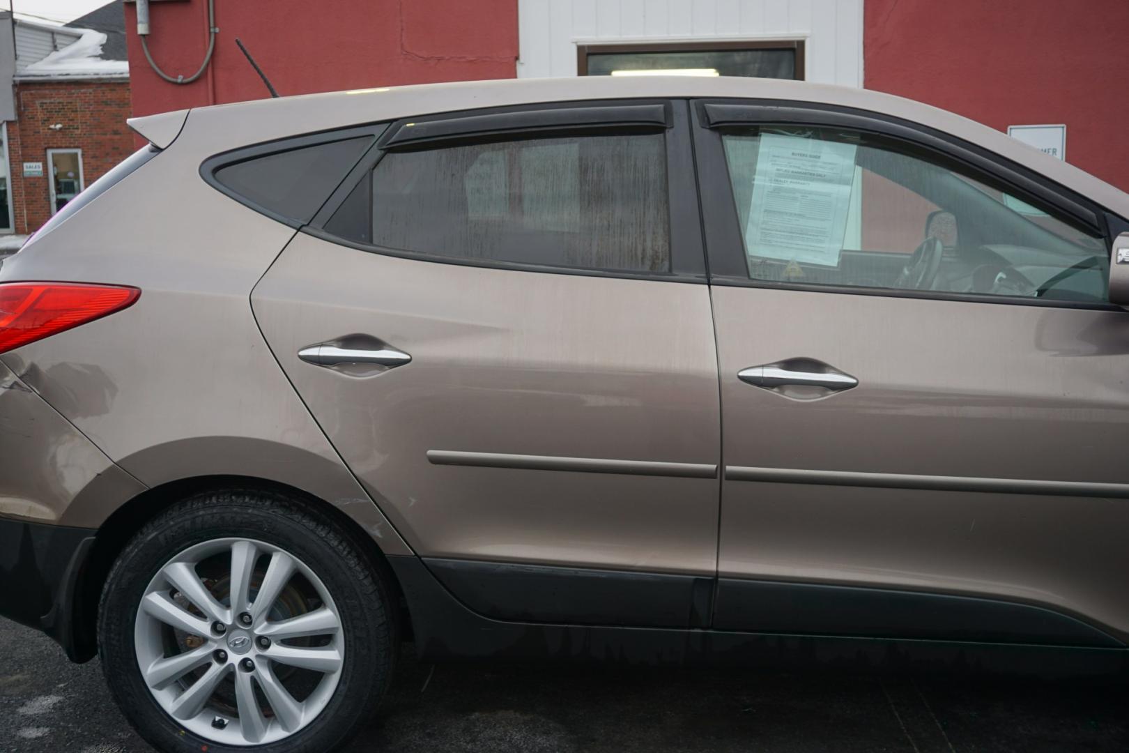 2010 Chai Bronze Metallic HYUNDAI TUCSON LIMITED (KM8JUCAC1AU) with an 2.4L L4 DOHC 16V engine, 6-Speed Automatic transmission, located at 312 Centre Ave, Schuylkill Haven, PA, 17972, (570) 593-5278, 40.638130, -76.177383 - Photo#18