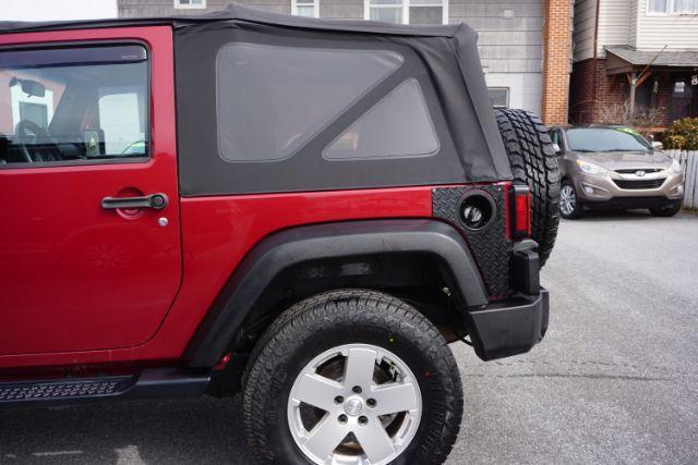 2013 Flame Red Clearcoat /Black Jeep Wrangler Sport (1C4AJWAG3DL) with an 3.6L V-6 DOHC engine, located at 312 Centre Ave, Schuylkill Haven, PA, 17972, (570) 593-5278, 40.638130, -76.177383 - Photo#4