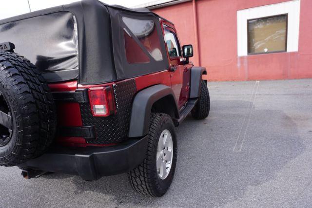 2013 Flame Red Clearcoat /Black Jeep Wrangler Sport (1C4AJWAG3DL) with an 3.6L V-6 DOHC engine, located at 312 Centre Ave, Schuylkill Haven, PA, 17972, (570) 593-5278, 40.638130, -76.177383 - Photo#12
