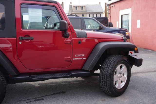 2013 Flame Red Clearcoat /Black Jeep Wrangler Sport (1C4AJWAG3DL) with an 3.6L V-6 DOHC engine, located at 312 Centre Ave, Schuylkill Haven, PA, 17972, (570) 593-5278, 40.638130, -76.177383 - Photo#16