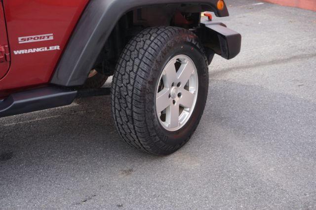 2013 Flame Red Clearcoat /Black Jeep Wrangler Sport (1C4AJWAG3DL) with an 3.6L V-6 DOHC engine, located at 312 Centre Ave, Schuylkill Haven, PA, 17972, (570) 593-5278, 40.638130, -76.177383 - Photo#19