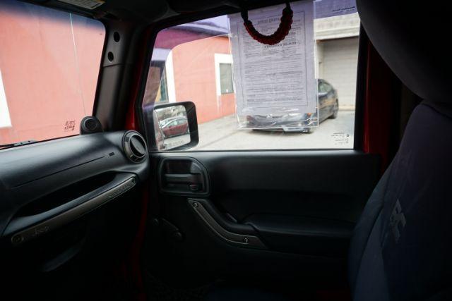 2013 Flame Red Clearcoat /Black Jeep Wrangler Sport (1C4AJWAG3DL) with an 3.6L V-6 DOHC engine, located at 312 Centre Ave, Schuylkill Haven, PA, 17972, (570) 593-5278, 40.638130, -76.177383 - Photo#29
