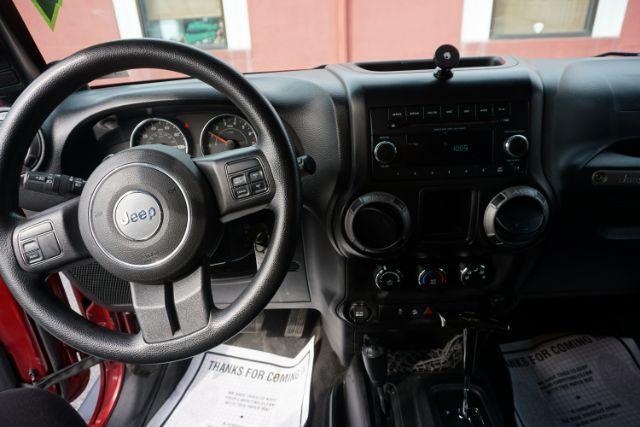 2013 Flame Red Clearcoat /Black Jeep Wrangler Sport (1C4AJWAG3DL) with an 3.6L V-6 DOHC engine, located at 312 Centre Ave, Schuylkill Haven, PA, 17972, (570) 593-5278, 40.638130, -76.177383 - Photo#32